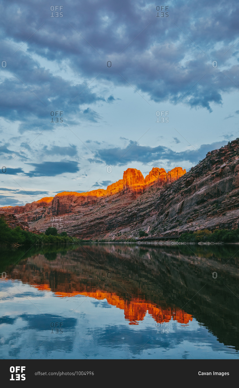 Sunset over mountain by Colorado River in Moab, Utah.