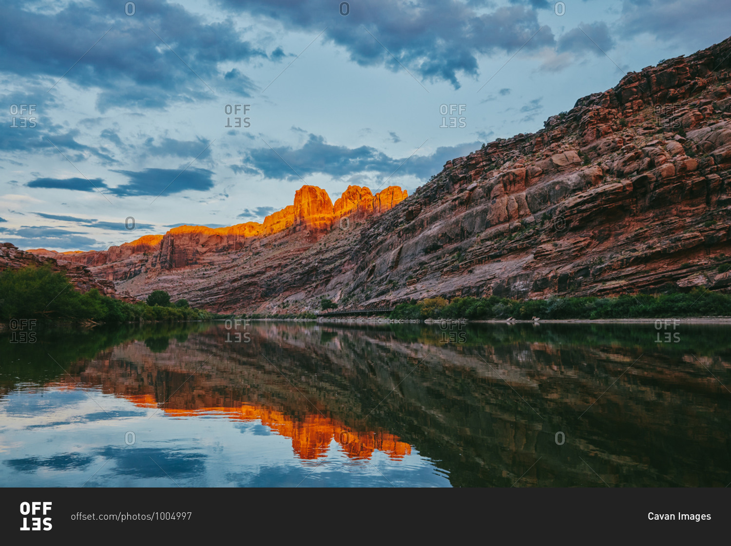 Sunset over mountain by Colorado River in Moab, Utah.