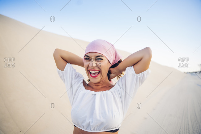 Young woman with pink headscarf fighting cancer