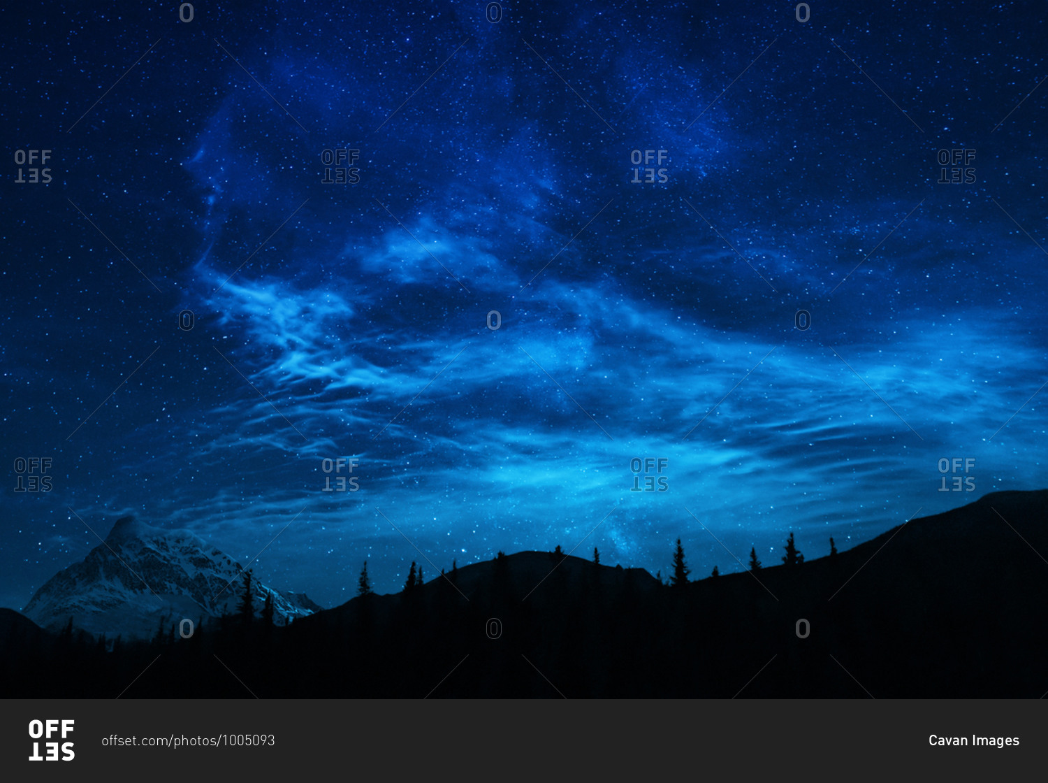 Blue Night Sky Stars And Milky Way In Mountain Scene stock photo - OFFSET
