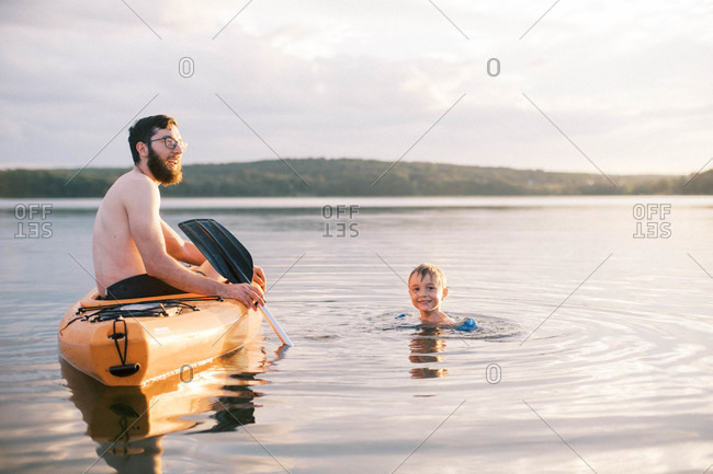 A father and son enjoying a hot summer day at the lake together