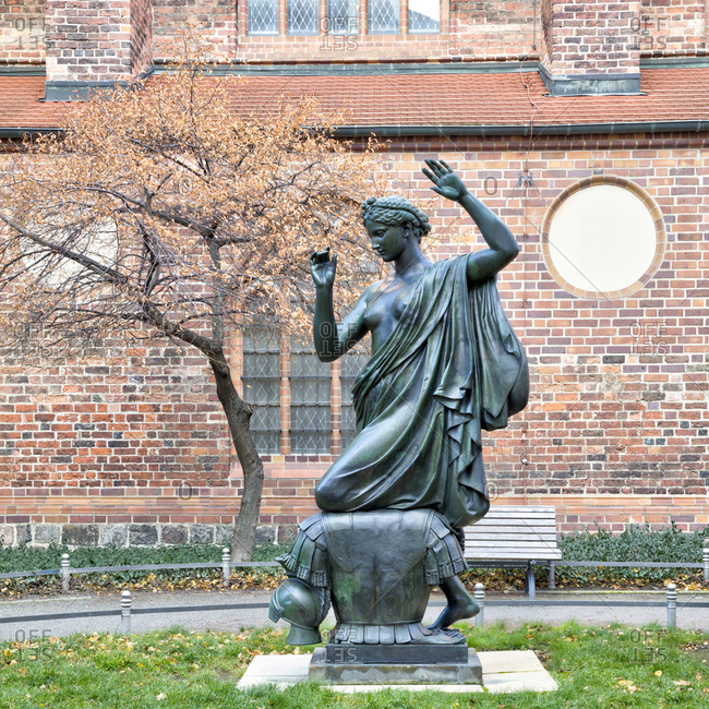 December 3, 2019: Bronze statue klio, Clio, the muse of history, Albert Wolff, 1876, Nikolaikirche, Nikolaiviertel, Berlins historical center, Berlin, Germany