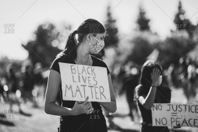 Young women peacefully protesting for the Black Lives Matter movement