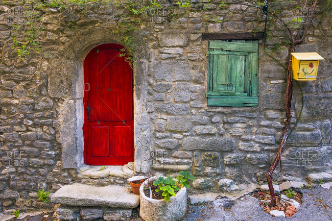 June 30, 2013: Europe, France, Saignon. Rustic stone house exterior.