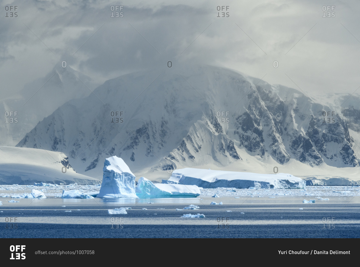 Antarctica, Antarctic Peninsula, Andvord Bay. Iceberg and mountain landscape.