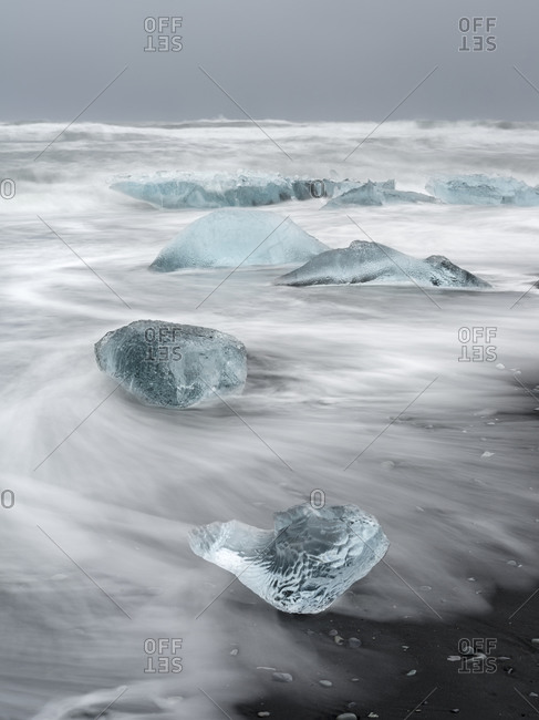Icebergs on black volcanic beach, Iceland.