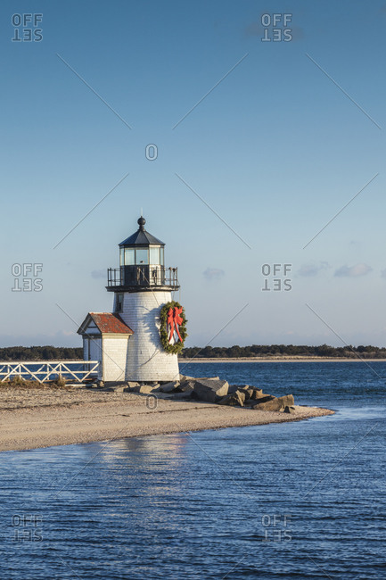 USA, Massachusetts, Nantucket Island. Nantucket Town, Brant Point Lighthouse with a Christmas wreath.