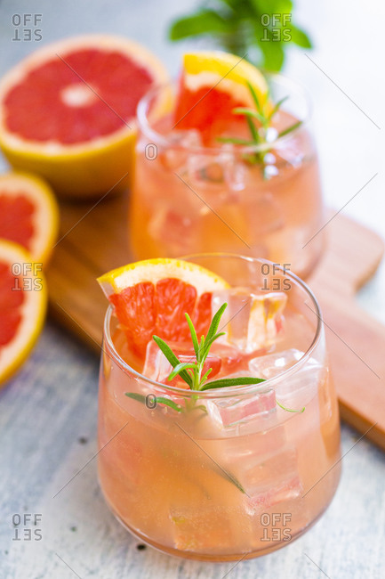 Glasses of fresh grapefruit juice and grapefruits