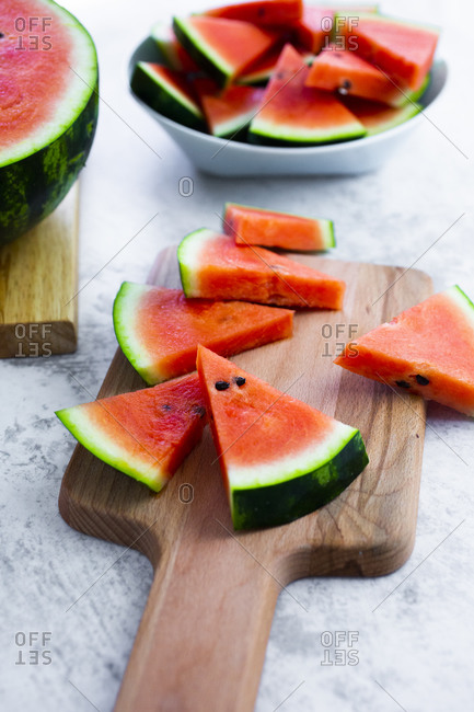 Chopped watermelon on chopping board