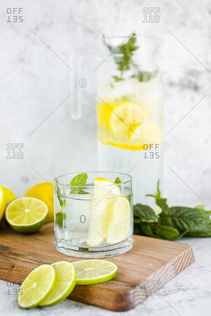 Detox water with lemon- lime and mint and ice cubes
