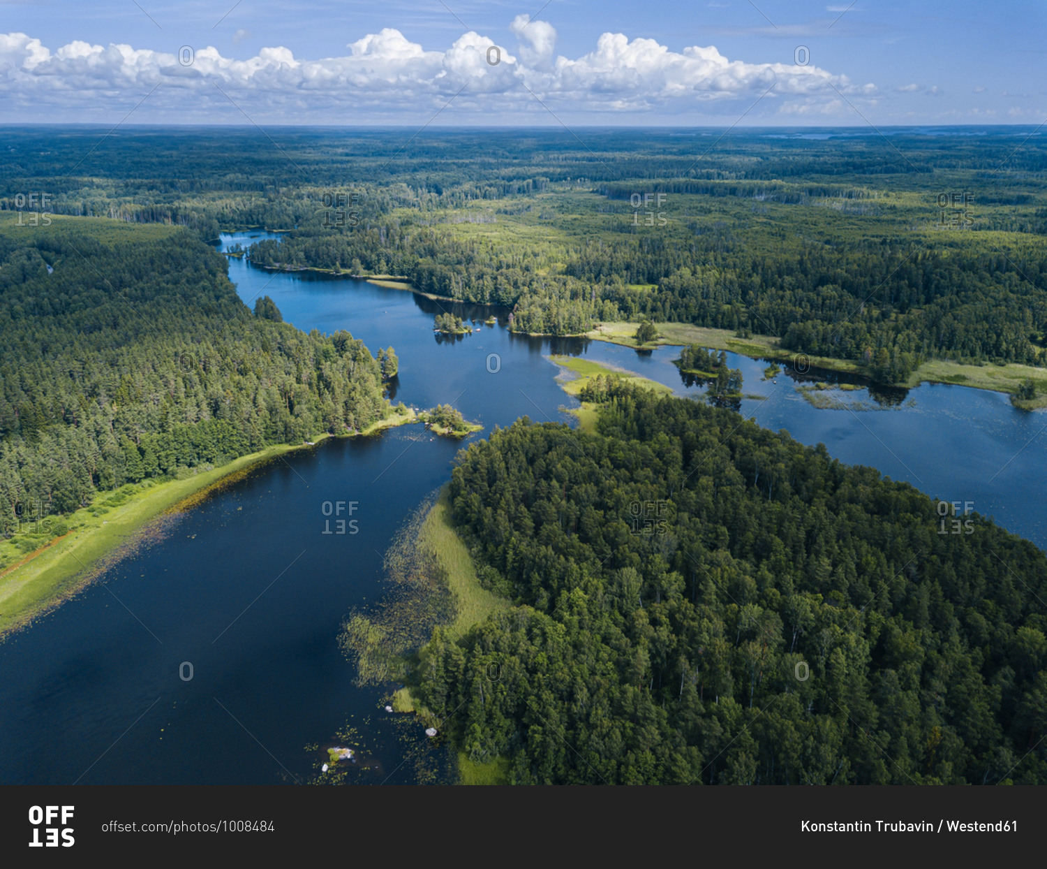 Aerial view of green forest surrounding Vuoksi river in summer