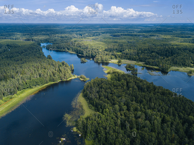 Aerial view of green forest surrounding Vuoksi river in summer