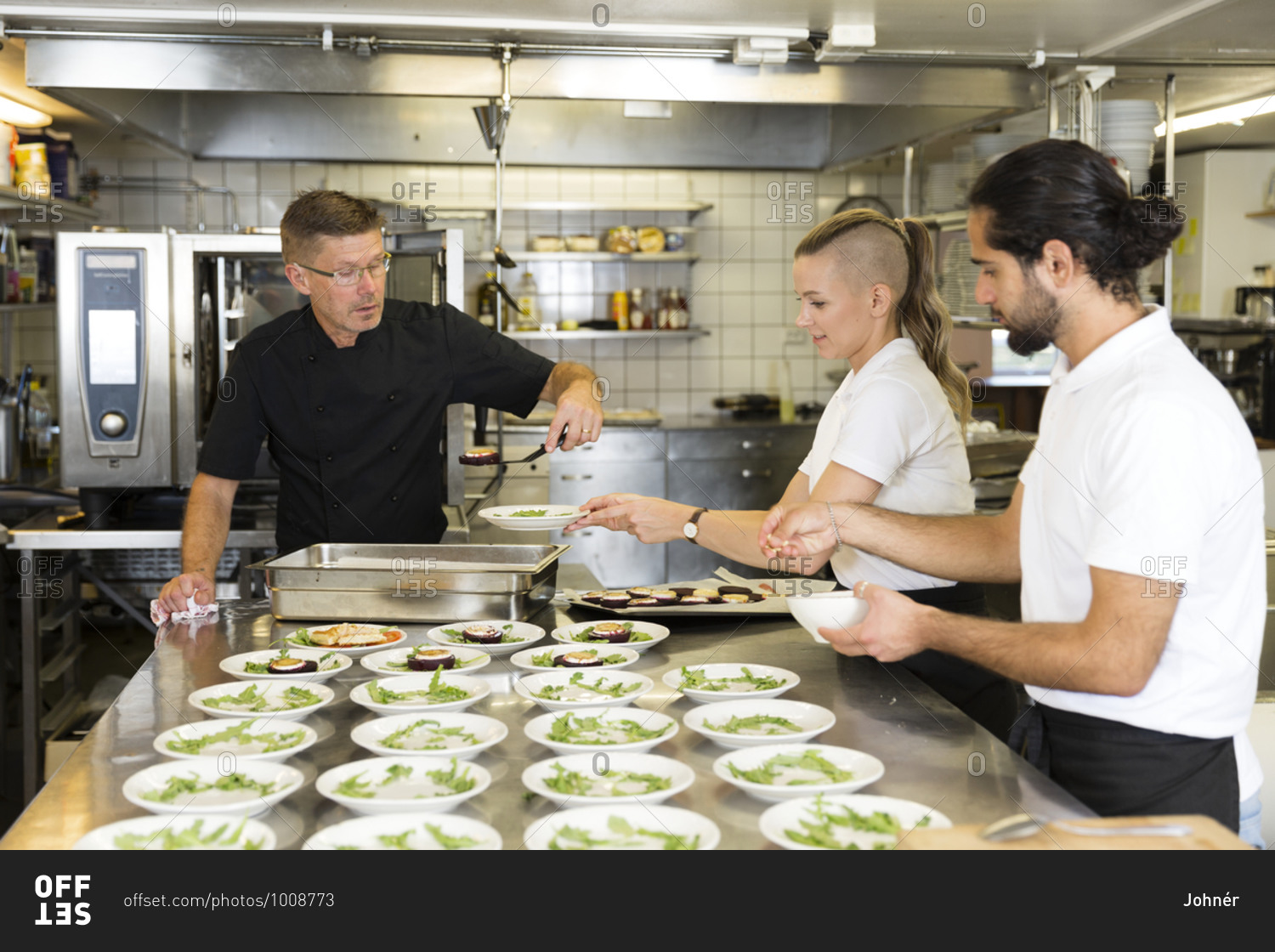 People working in restaurant kitchen