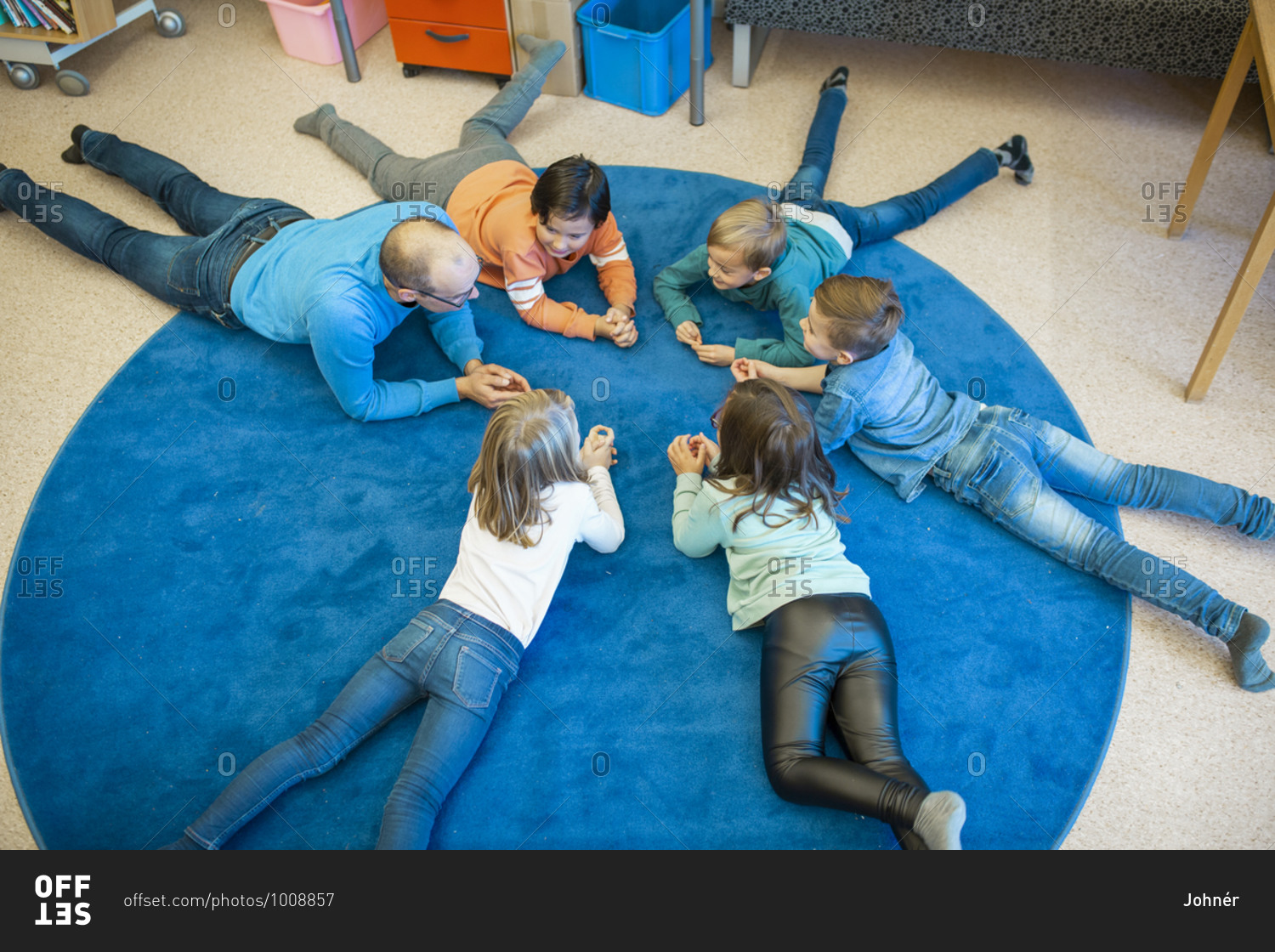 Teacher on floor with children