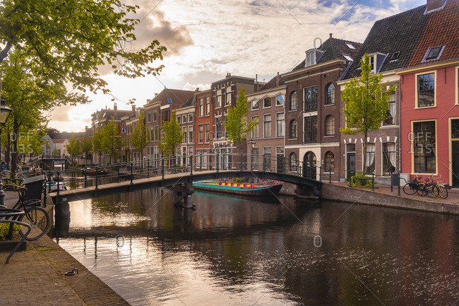 Netherlands- South Holland- Leiden- Bridge and historical houses on Oude Rijn canal