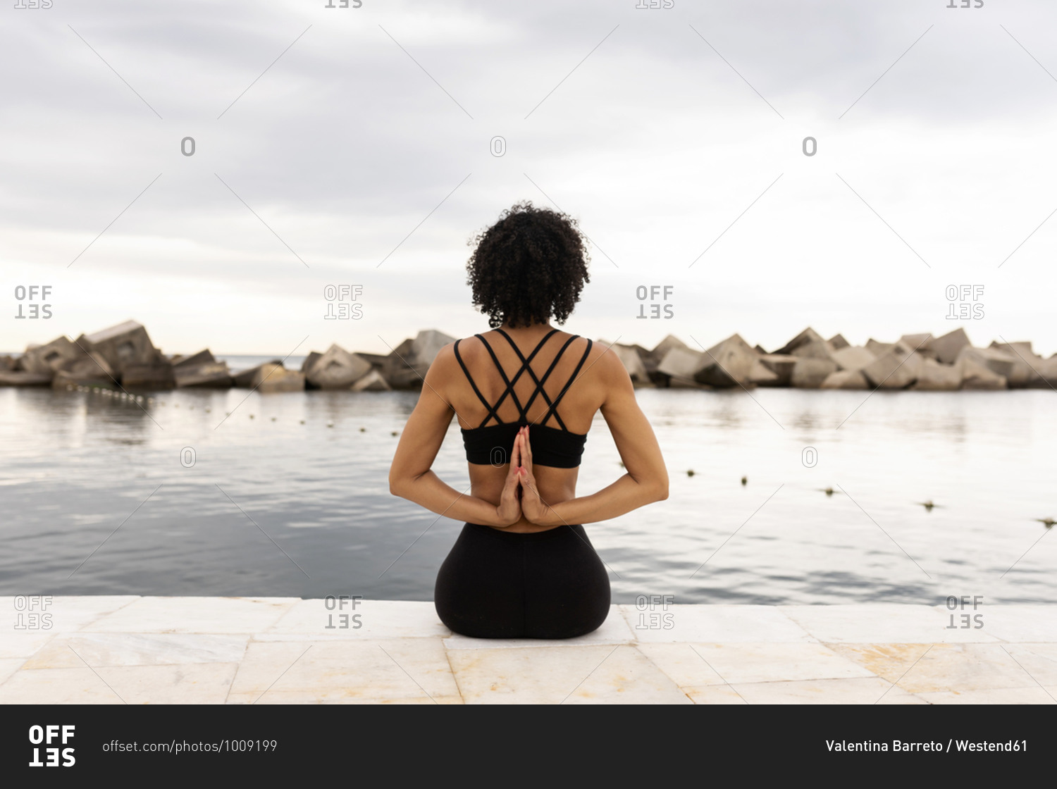 Mid Adult Woman Doing Yoga Against by Westend61