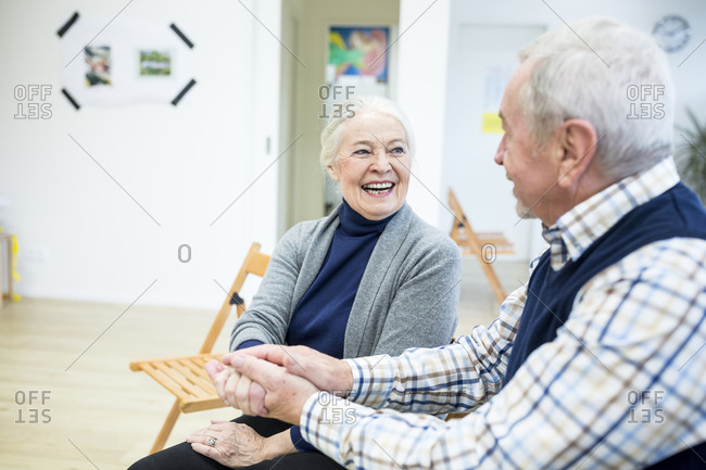 Happy seniors meeting in retirement home