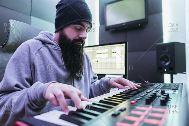 DJ producing music in his studio