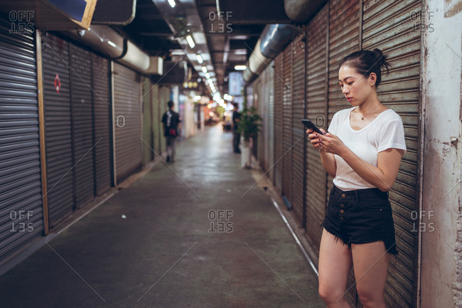 Asian young girl walking in the shopping candid