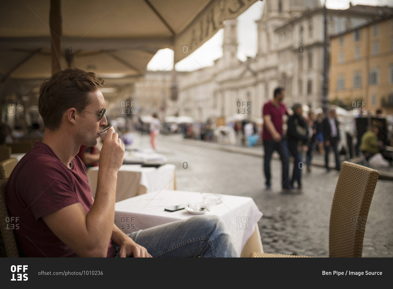 Man enjoying espresso at restaurant, Piazza Navona, Rome, Italy