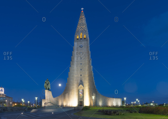 Hallgrimskirkja church and statue illuminated at night, Reykjavik, Iceland