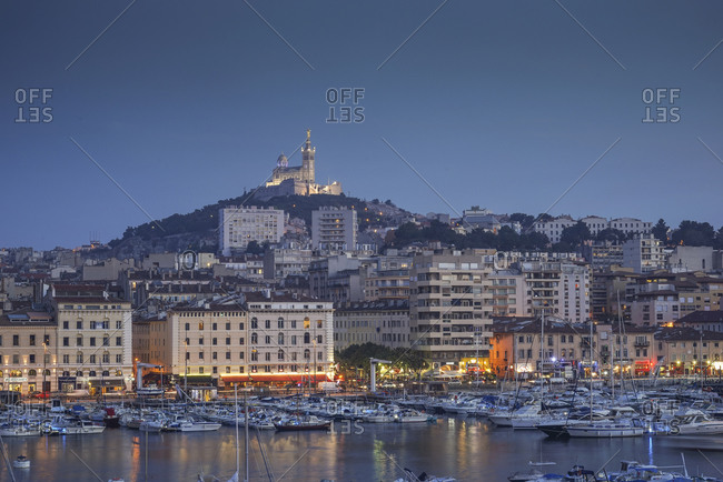 Boats in marina, Vieux-Port, Notre Dame de la Garde in background, Marseille, France
