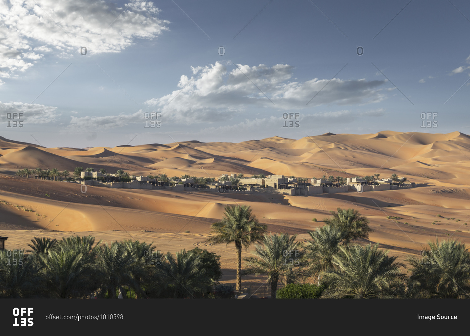 Distant view of Qsar Al Sarab desert resort among sand dunes, Empty Quarter Desert, Abu Dhabi, United Arab Emirate
