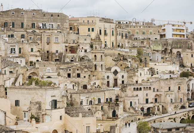 View of traditional building exteriors on hillside, Matera, Basilicata, Italy