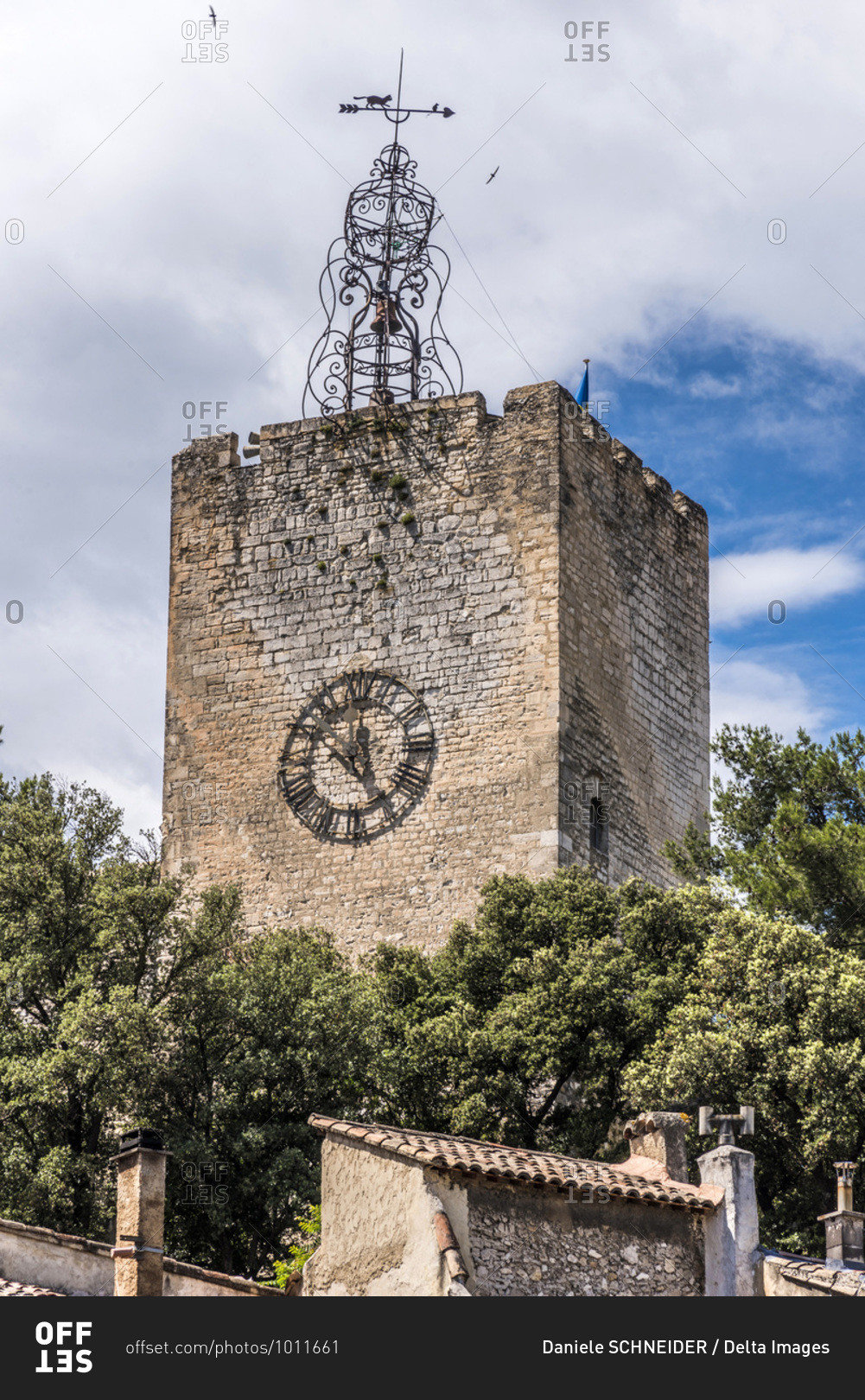 France, Provence-Alpes-Cote d\'Azur, Vaucluse, Pernes-les-Fontaines, bell tower (12th century), wrought iron steeple (18th century) and a weather vane with a cat chasing a mouse.