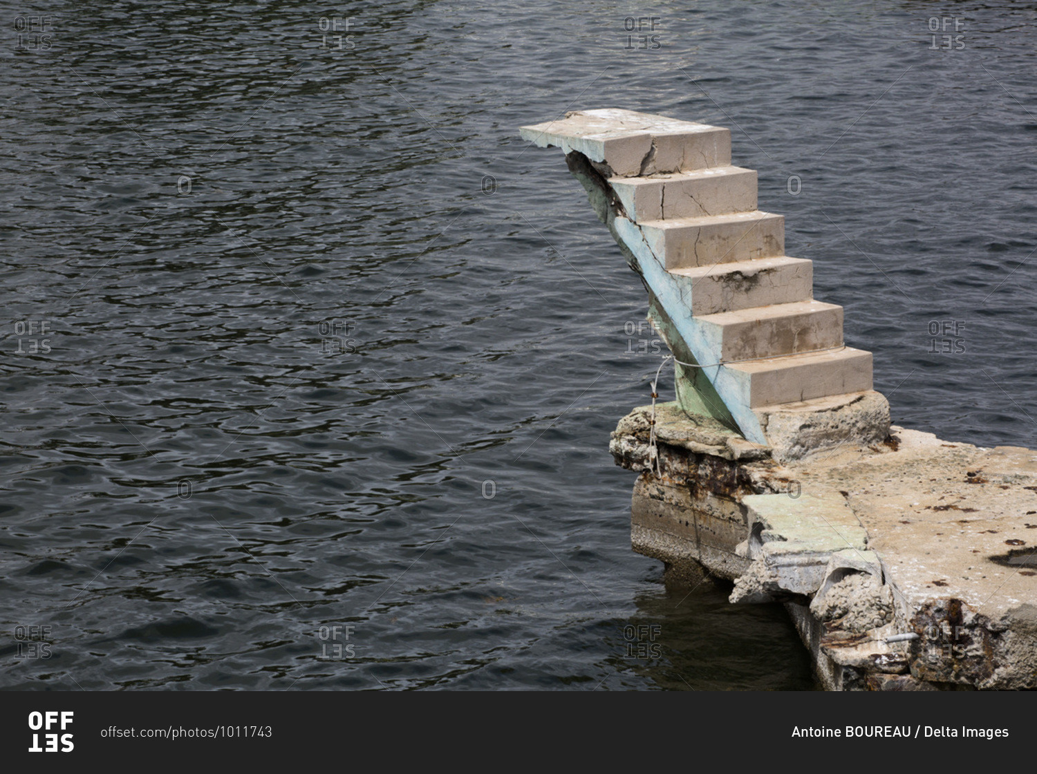 Concrete staircase built to allow access to a swimming pool located just above the sea but the project was abandoned, Santiago de Cuba, Cuba