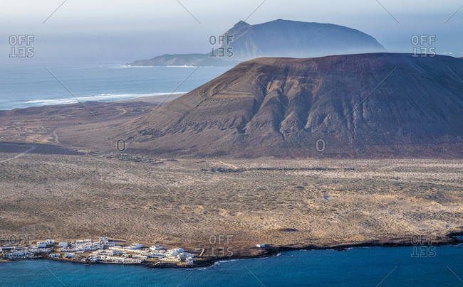 Spain, Canary Islands, Lanzarote Island, Viewpoint from the Mirador del Rio, view of the islands of La Graciosa, Montana Clara and Caleta de Selva harbor