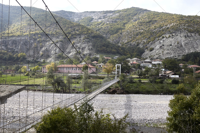 Nenkovo, Bulgaria - August 15, 2020: Rope bridge over the river Borovitsa leading to the village of Nenkovo