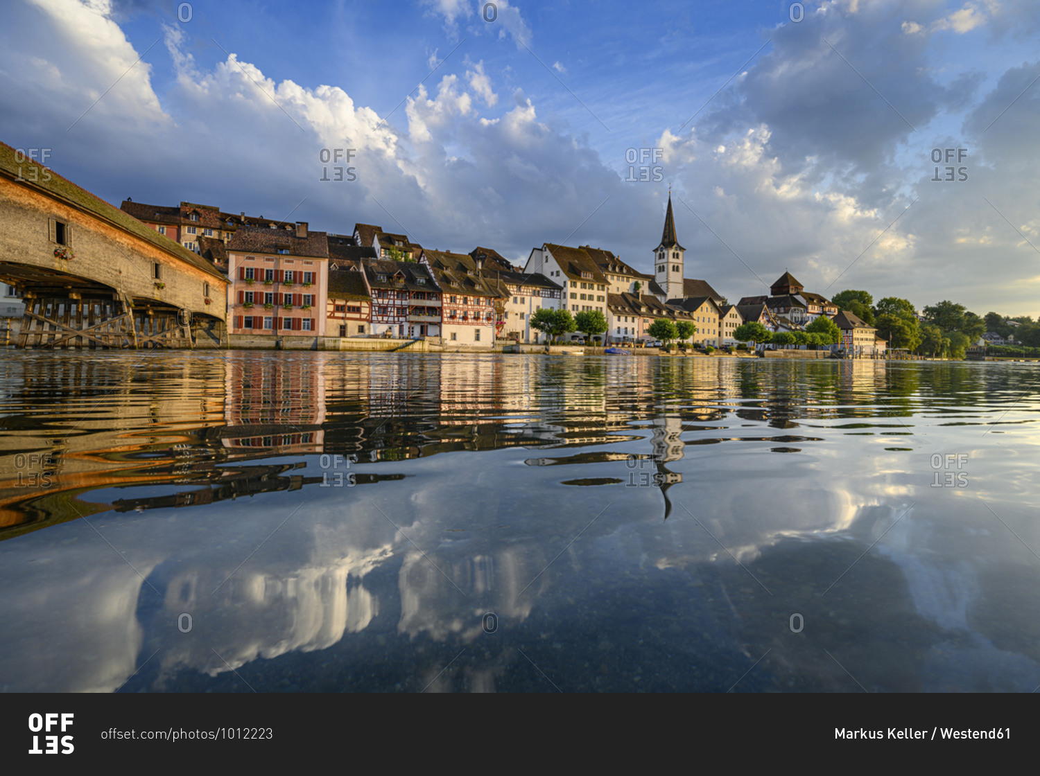 Switzerland- Canton of Thurgau- Diessenhofen- Shiny surface of High Rhine with village houses in background