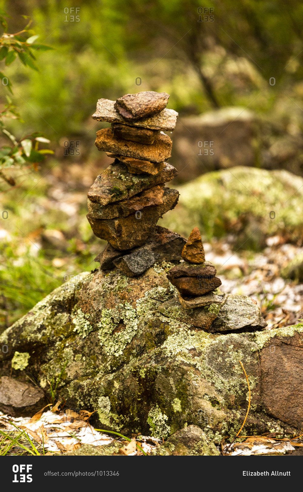 Stacked stone cairn with moss covered rocks stock photo -
OFFSET