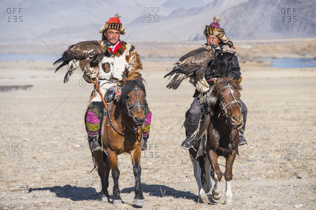 Mongolia, Bayan-Olgiy, Olgiy - October 7, 2018: Nomadic eagle hunters on horses Oligemic Bayan-Olgiy, Mongolia