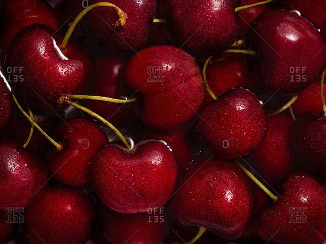 Macro image of cherries filling the entire frame.