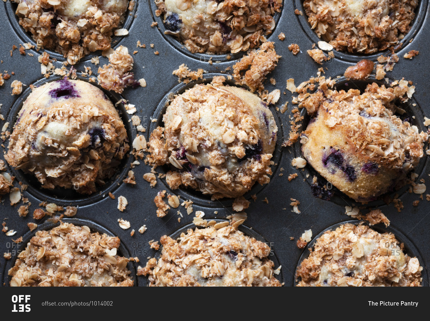 Freshly baked homemade mixed berry oat muffins.