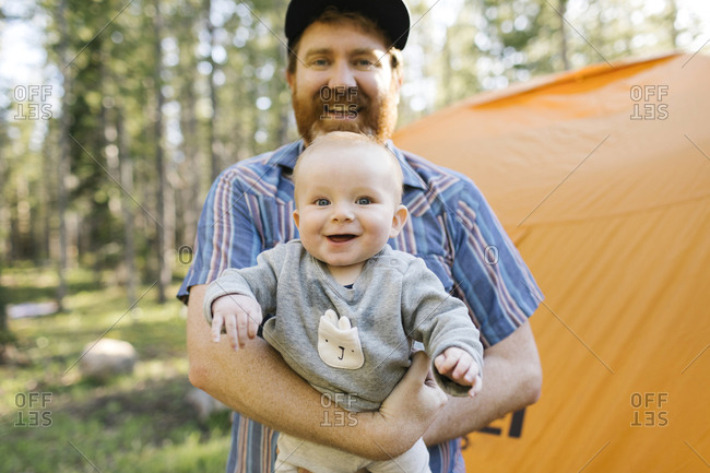 Portrait of happy father with baby son (6-11 months) in Uinta-Wasatch-Cache National Forest