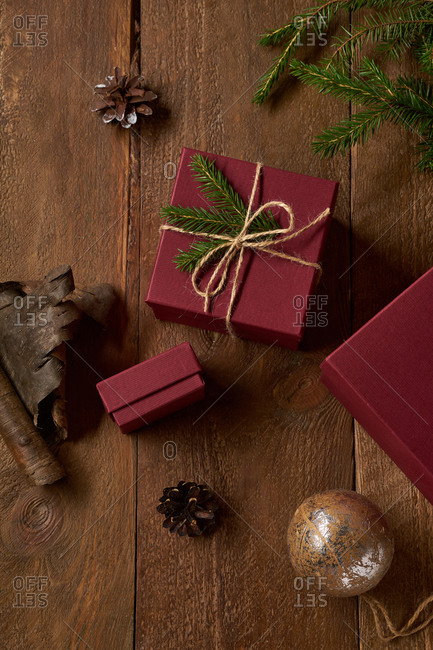 Top view of decorated christmas gifts and boxes with presents on wooden background