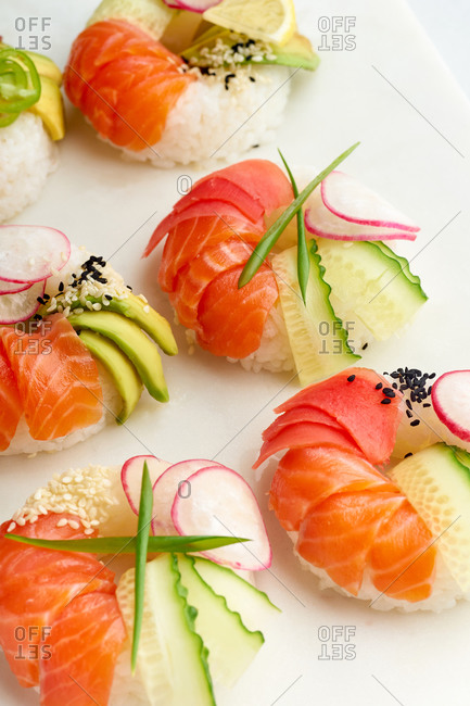 Closeup shot of sushi donuts with salmon and veggies