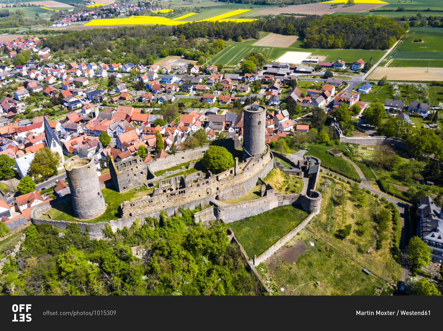 Germany- Hesse- Munzenberg- Helicopter view of Munzenberg Castle and surrounding village in summer