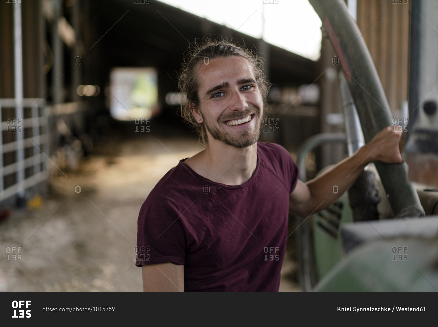 Portrait of a smiling young farmer on a farm