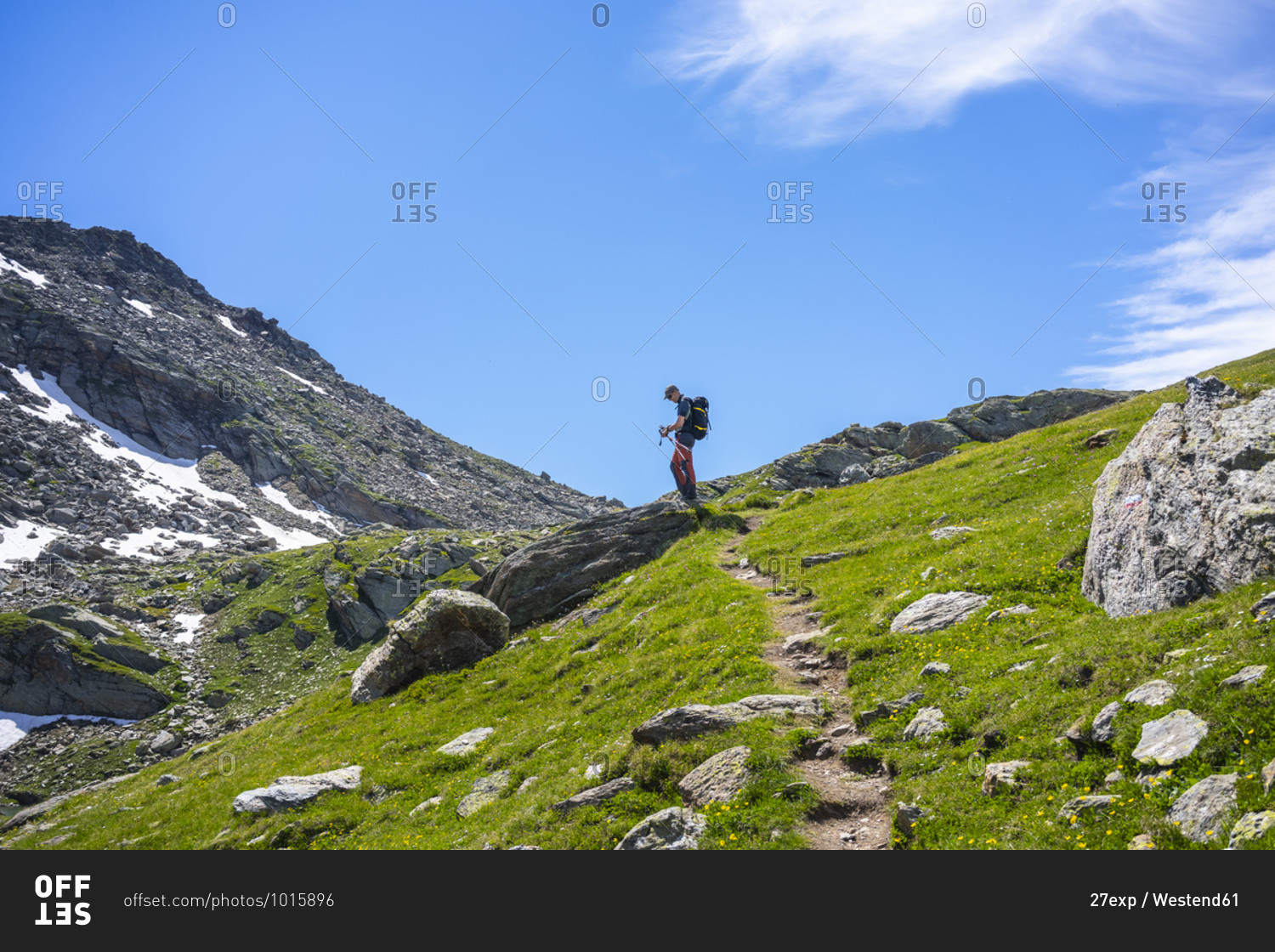 Man on hiking trail of mountain at Western Rhaetian Alps- Sondrio- Italy