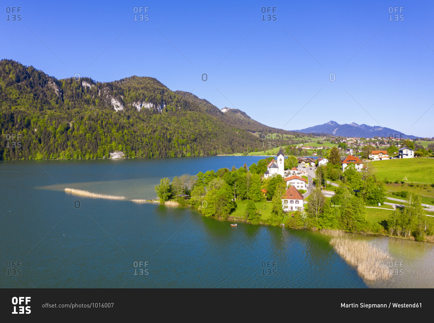 Germany- Bavaria- Fussen- Drone view of village on shore of Weissensee lake