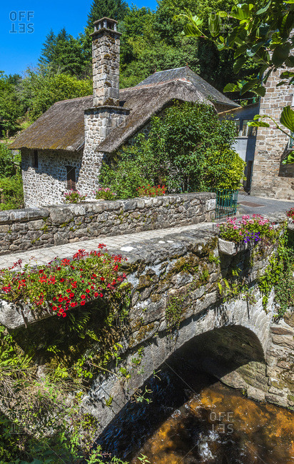 France,  Limousine,  Correze,  Gimel-les-Cascades,  Peage bridge and granite house with tatched roof