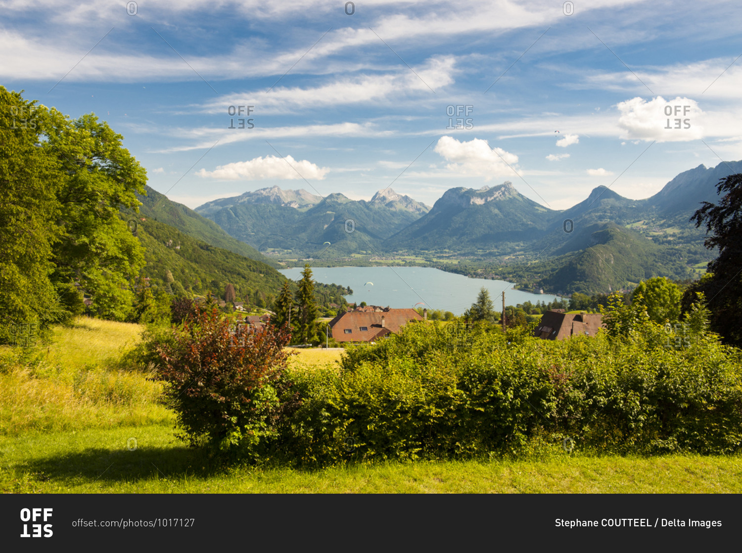 France,  Savoie,  Annecy,  panoramic view of the Lake flown over by paragliders