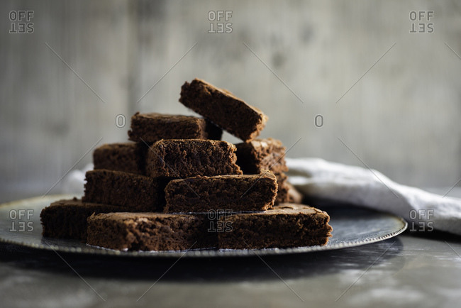 Chocolate brownies on plate with napkin