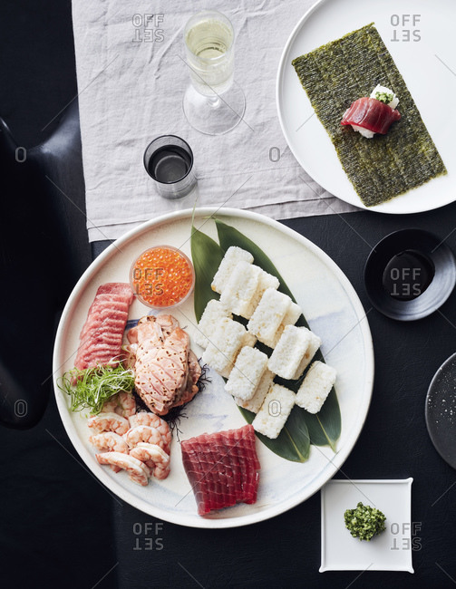 Japanese Sushi Set. Sashimi, Maki Rolls. On Plate Over Stone