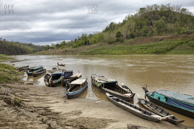 Boats on the banks of the Sangu river near the Bandarban District of Bangladesh