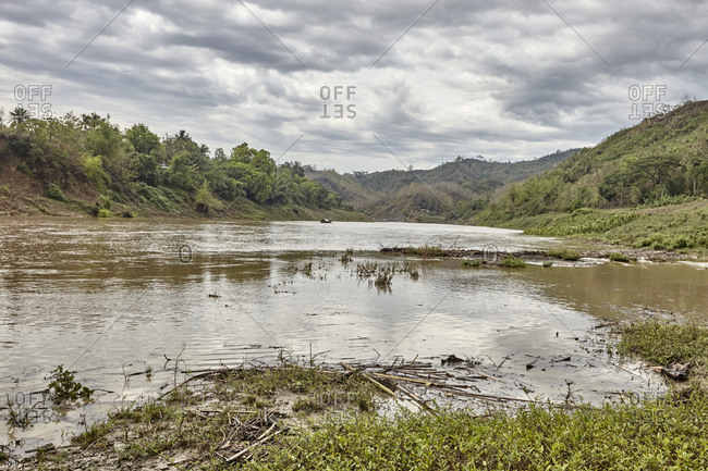 Bandarban, Bangladesh - May 6, 2013: The Sangu River surrounded by rainforest covered hills
